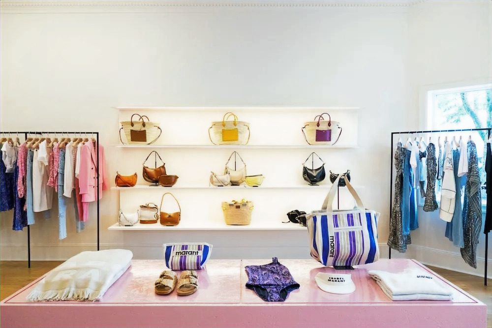 Accessory display wall: floating white shelves with soft-lit